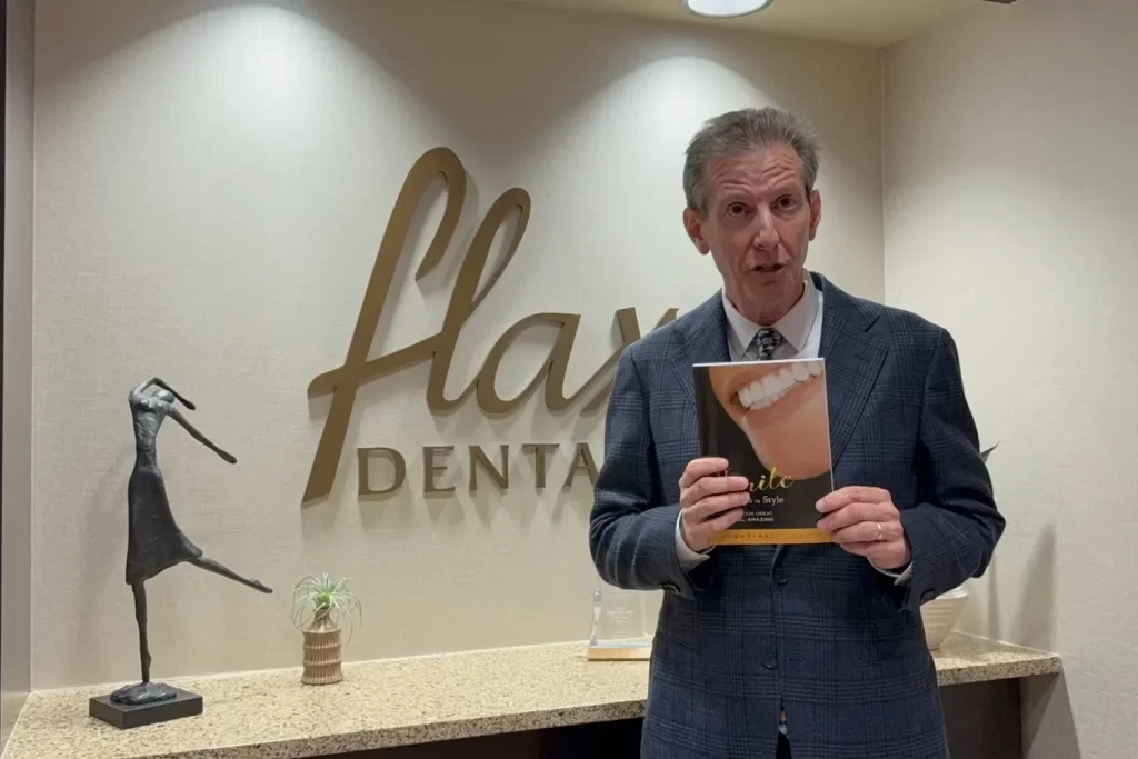 Hugh Flax with his book