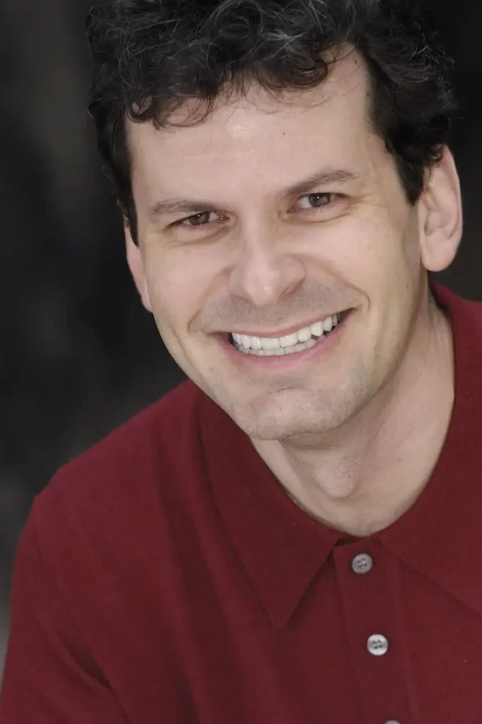 Patient portrait after gum lift, orthodontics and veneers at Flax Dental, Atlanta